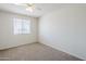An inviting bedroom boasts neutral carpet, a large window for natural light, and a serene atmosphere for restful nights at 11631 N 30Th St, Phoenix, AZ 85028