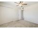 A bright bedroom with a ceiling fan and large closets offers comfort and convenience at 11631 N 30Th St, Phoenix, AZ 85028