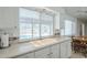 Kitchen with a view of the pool, complemented by an adjacent dining area at 11631 N 30Th St, Phoenix, AZ 85028