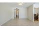 Spacious living room with tile floors offers access to multiple rooms at 11631 N 30Th St, Phoenix, AZ 85028