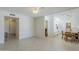 Open-concept living room with tile flooring, leading to the kitchen and bedrooms at 11631 N 30Th St, Phoenix, AZ 85028