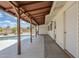 Covered patio area with dark wood beams and a view of the pool at 11631 N 30Th St, Phoenix, AZ 85028