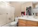 Bathroom with shower and bath combination, vanity and mirrored wall at 1268 N Pine St, Gilbert, AZ 85233