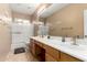 Bathroom featuring a dual sink vanity and combination tub and shower at 1268 N Pine St, Gilbert, AZ 85233