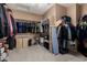 Walk-in closet with ample storage space featuring rods and shelving at 1268 N Pine St, Gilbert, AZ 85233