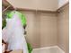 Modest closet with a few clothing items and minimal furnishings at 1268 N Pine St, Gilbert, AZ 85233