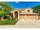 Inviting two-story home with a well-manicured lawn and a three-car garage at 1268 N Pine St, Gilbert, AZ 85233