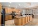 Spacious kitchen with granite countertops, stainless steel appliances, and breakfast nook at 1268 N Pine St, Gilbert, AZ 85233