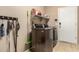 Convenient laundry room with modern washer and dryer, shelving and tile floors at 1268 N Pine St, Gilbert, AZ 85233