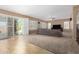 Cozy living room with a sliding glass door, plush sofa, and neutral tones at 1268 N Pine St, Gilbert, AZ 85233