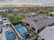 Stunning aerial view of backyard oasis with pool, spa, and modern architecture at 1337 E Paseo Way, Phoenix, AZ 85042