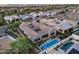 Stunning aerial view of a luxury home featuring a pool, spa, and meticulously landscaped backyard oasis at 1337 E Paseo Way, Phoenix, AZ 85042