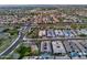 Aerial perspective captures homes with pools and desert landscaping in a residential area near a road at 1337 E Paseo Way, Phoenix, AZ 85042