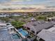 Beautiful aerial view of backyard featuring a pool, spa, and covered seating area at 1337 E Paseo Way, Phoenix, AZ 85042