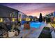 Relaxing outdoor space with lounge chairs, cozy seating, and a shimmering pool with water features at 1337 E Paseo Way, Phoenix, AZ 85042
