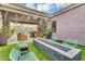 Beautiful backyard with a fire pit, seating area, and outdoor bar, ideal for entertainment and relaxation at 1337 E Paseo Way, Phoenix, AZ 85042