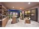Elegant backyard featuring a bar, seating, and lush greenery, creating an ideal outdoor entertaining space at 1337 E Paseo Way, Phoenix, AZ 85042