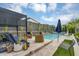 Charming backyard featuring a covered pergola, comfortable seating, and a refreshing pool with a spa at 1337 E Paseo Way, Phoenix, AZ 85042