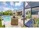 Serene outdoor living space with comfortable seating, a pergola, and a pool with a spa, perfect for relaxation at 1337 E Paseo Way, Phoenix, AZ 85042
