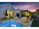 Inviting backyard retreat with comfortable seating, a modern pergola, and a sparkling pool at 1337 E Paseo Way, Phoenix, AZ 85042