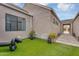 Serene backyard with lush artificial turf, decorative sculptures, and comfortable seating, perfect for outdoor relaxation at 1337 E Paseo Way, Phoenix, AZ 85042