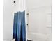 Clean bathroom featuring a white tiled shower and a stylish ombre shower curtain, creating a soothing and functional space at 1337 E Paseo Way, Phoenix, AZ 85042