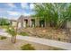 Home exterior featuring desert landscaping, paver driveway, and modern architectural details at 1337 E Paseo Way, Phoenix, AZ 85042