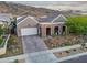 Beautiful single-story home with xeriscaping, a paved driveway, and stunning mountain views at 1337 E Paseo Way, Phoenix, AZ 85042