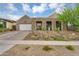 Inviting home exterior showcasing desert landscaping, a paver driveway, and a modern facade at 1337 E Paseo Way, Phoenix, AZ 85042