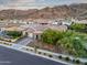 Charming front yard with desert landscape, mature trees, and mountain views at 1337 E Paseo Way, Phoenix, AZ 85042