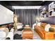 Cozy home theater with a large screen, comfortable seating, and atmospheric lighting at 1337 E Paseo Way, Phoenix, AZ 85042