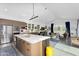 Bright and airy kitchen seamlessly blends into the open-concept living space with modern appliances and an island at 1337 E Paseo Way, Phoenix, AZ 85042