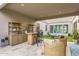 Inviting outdoor patio area with a built-in bar, comfortable seating, and a cozy fire pit at 1337 E Paseo Way, Phoenix, AZ 85042