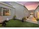 Cozy patio area with artificial turf, stylish seating, and an architectural design at 1337 E Paseo Way, Phoenix, AZ 85042