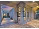 Charming outdoor patio with paver flooring, large windows, and modern architectural details at 1337 E Paseo Way, Phoenix, AZ 85042