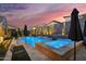 Backyard pool and spa with desert landscaping and lighting offering a resort-style oasis at 1337 E Paseo Way, Phoenix, AZ 85042