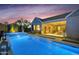 Stunning backyard pool featuring a built-in spa, outdoor bar, and lush landscaping at 1337 E Paseo Way, Phoenix, AZ 85042