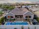 Aerial view showcasing a modern pool with a spa and outdoor seating area at 1337 E Paseo Way, Phoenix, AZ 85042