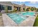 Gorgeous pool and spa featuring a tile surround, perfect for relaxation and entertaining guests at 1337 E Paseo Way, Phoenix, AZ 85042