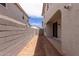 View of the backyard featuring a concrete block fence and sliding glass doors at 15599 S 180Th Ln, Goodyear, AZ 85338