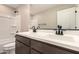 Well-lit bathroom with modern finishes, including dual sinks, granite countertop, and shower and tub combo at 15599 S 180Th Ln, Goodyear, AZ 85338