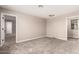 Carpeted room with windows, and two open doorways at 15599 S 180Th Ln, Goodyear, AZ 85338