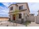 Charming two-story home featuring a tile roof and covered porch in a new residential neighborhood at 15599 S 180Th Ln, Goodyear, AZ 85338