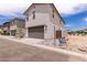 Two story home featuring a two car garage and a stucco exterior at 15599 S 180Th Ln, Goodyear, AZ 85338