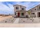 Attractive two-story home with a covered porch, desert landscaping, and inviting curb appeal at 15599 S 180Th Ln, Goodyear, AZ 85338