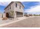 Two story home featuring a two car garage and desert landscaping at 15599 S 180Th Ln, Goodyear, AZ 85338