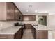 Well-equipped kitchen with granite countertops, stainless steel appliances, and a spacious island at 15599 S 180Th Ln, Goodyear, AZ 85338