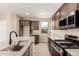 Kitchen area with granite countertops, stainless steel appliances, and a center island at 15599 S 180Th Ln, Goodyear, AZ 85338