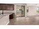 Open-concept kitchen with granite countertops, stainless steel appliances, and tile flooring at 15599 S 180Th Ln, Goodyear, AZ 85338