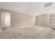 Large living room with neutral carpet, recessed lighting, and ample natural light at 15599 S 180Th Ln, Goodyear, AZ 85338